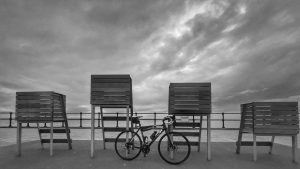 image of bike against beach furniture image