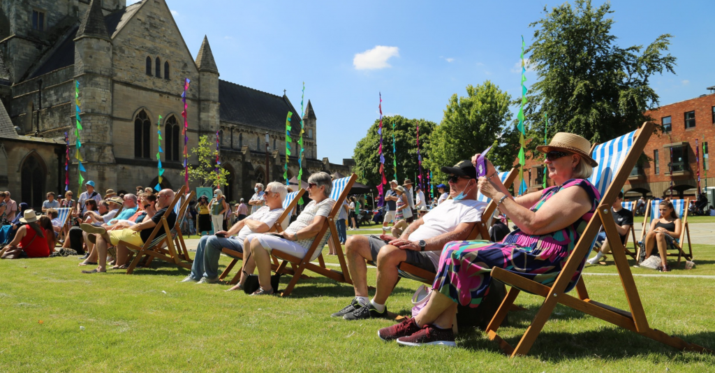 People in deckchairs enjoying Festival of the Sea at Grimsby Minster